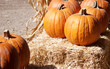 Orange Pumpkins on bales of straw Orange Pumpkins on bales of straw