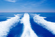 Photo: Boat wake prop wash on blue ocean sea Boat wake prop wash on blue ocean sea