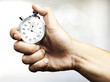 hand holding stopwatch