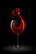Glass of red wine on a black background