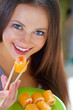 Photo: Beautiful Young Woman Eating Sushi. Diet Beautiful Young Woman Eating Sushi. Diet
