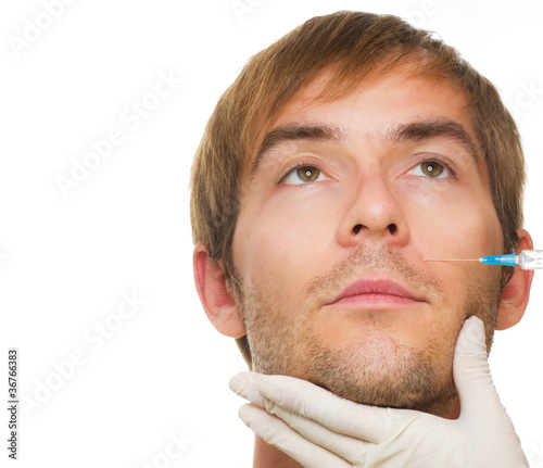 Photo: Man gets cosmetic injection of botox. Beauty Treatment Man gets cosmetic injection of botox. Beauty Treatment