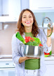 Beautiful Young Woman cooking fresh Vegetables Beautiful Young Woman cooking fresh Vegetables