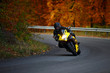 Photo: man riding with speedbike in autumn man riding with speedbike in autumn