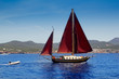 Ibiza Red sails sailboat in Sa Talaia coast Ibiza Red sails sailboat in Sa Talaia coast