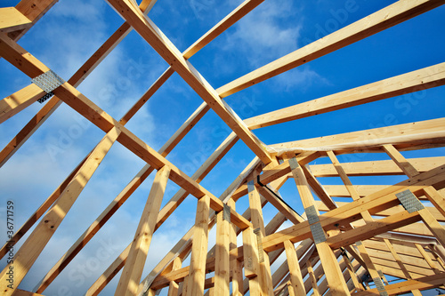 Photo: looking up to the roof structure in a modern timber-frame house looking up to the roof structure in a modern timber-frame house