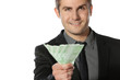 Photo: Young business man offering pack of Euro money Young business man offering pack of Euro money