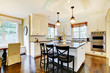 Photo: White large luxury modern kitchen wih dark floor White large luxury modern kitchen wih dark floor
