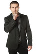 Business man with finger on lips asking for silence