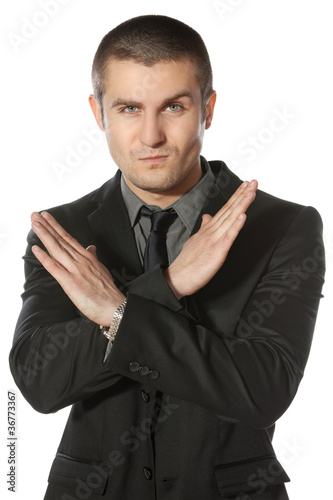 Photo: Young business man making enough gesture Young business man making enough gesture