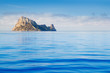 Ibiza Es Vedra island in calm blue water Ibiza Es Vedra island in calm blue water
