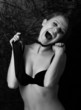 wild girl in a bra shouting in the dark