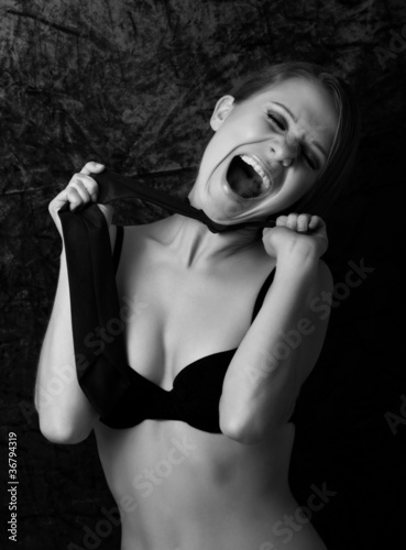 Photo: wild girl in a bra shouting in the dark wild girl in a bra shouting in the dark