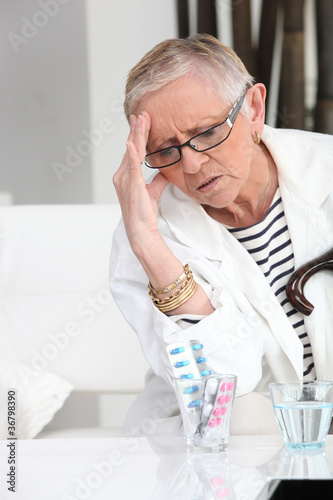 Photo: Older woman with a headache Older woman with a headache