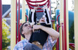 Photo: Active disabled five year old boy playing on the monkey bars wi Active disabled five year old boy playing on the monkey bars wi