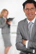 smiling businessman in foreground