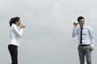 Asian Business man and woman using Tin Can Phone.