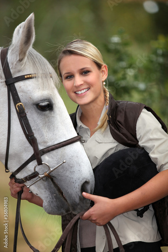 Photo: Blond teenage girl with horse Blond teenage girl with horse