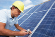 Photo: Man installing solar panels Man installing solar panels