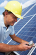 Photo: Man installing solar panels Man installing solar panels