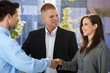 Businesspeople introducing outside of office