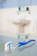 Photo: Toothbrush with toothpaste in bathroom Toothbrush with toothpaste in bathroom