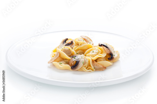 Photo: Tortellini dish with sauteed mushrooms and garlic Tortellini dish with sauteed mushrooms and garlic