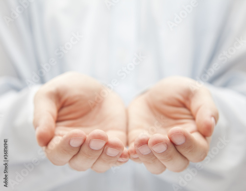 Photo: Open hands. Holding, giving, showing concept. Open hands. Holding, giving, showing concept.
