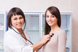 female doctor and smile girl in hospital