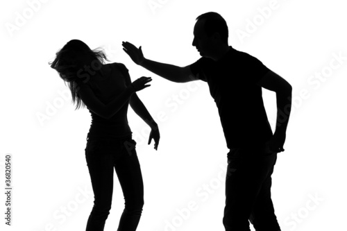 Photo: Silhouette of a man slapping a woman Silhouette of a man slapping a woman