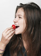 Young beautiful happy smiling woman with strawberry