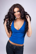 Portrait of a happy young woman with long wavy hair