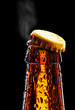 Photo: Top of open wet beer bottle Top of open wet beer bottle