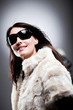 Woman wearing winter clothes and sunglasses