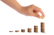 coins in finger and row stacks them isolated on white
