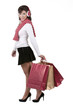 Photo: brunette young woman in high heels holding christmas bag gifts i brunette young woman in high heels holding christmas bag gifts i