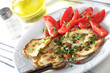 Roasted slices of pattypan with fresh tomato