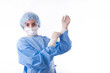 Photo: Female surgeon or nurse putting on sterile rubber gloves Female surgeon or nurse putting on sterile rubber gloves