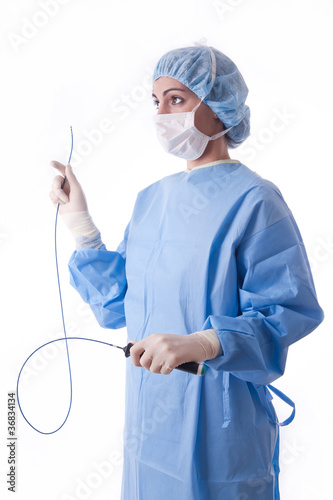 Foto: Female doctor or nurse holding a catheter Female doctor or nurse holding a catheter