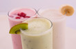 Various fruit smoothies isolated on white background