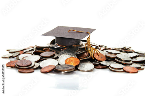 Photo: graduation cap on a pile of money ( student debt ) graduation cap on a pile of money ( student debt )
