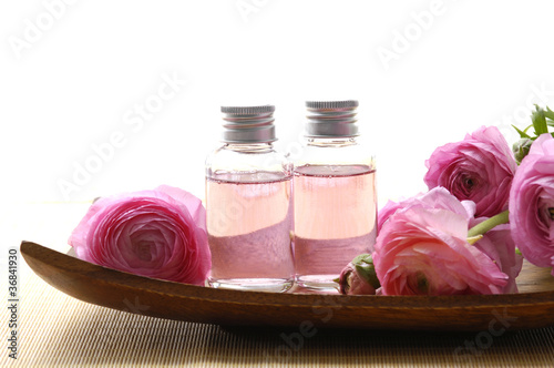 Photo: health spa setting with bottle of lavender massage oil health spa setting with bottle of lavender massage oil