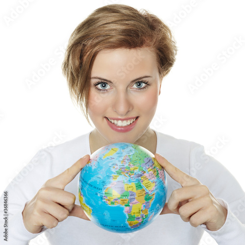 Foto: Young woman holding a globe in her hands Young woman holding a globe in her hands