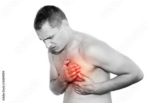 Photo: Young man having heart attack Young man having heart attack