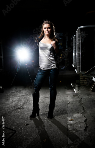 Photo: Young sexy girl posing in dark underground Young sexy girl posing in dark underground
