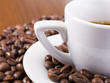 Photo: Espresso coffee surrounded with coffee beans Espresso coffee surrounded with coffee beans