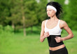 Woman running in green park