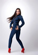 Cute girl with long hair in jeans dress