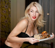 Young woman furtively at night regales cakes