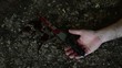 Conceptual footage of a hand holding a sharp knife